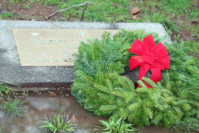 A wreath laid on a grave at the Lower Lake Cemetery in Lower Lake, Calif., on Saturday, December 13, 2014, as part of the annual Wreaths Across America commemoration. Photo by James Christenson. 121314wreathsgrave