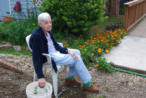 Habitat for Humanity “Brush of Kindness” program recipient Rose Duncan in her garden. Courtesy photo. roseduncan