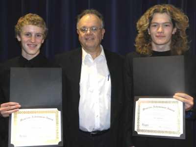 Clayton Rudiger and Aaron Bielenberg display their Allegro scholarship awards received during the Clear Lake Performing Arts Youth Orchestra concert on Sunday, June 10, 2012, from Allegro Director Tom Ganoung (center). Courtesy photo. 061012clpaallegroawards