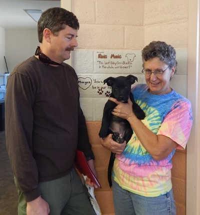 Lynn Eutenier and Bruce Fraser with their new fur-ever puppy, Daisy, at the SPCA of Clear Lake's Cat and Dog Days of Summer adoption event, which took place Saturday, June 28, and Sunday, June 29, 2014, in Kelseyville, Calif. Photo courtesy of the SPCA of Clear Lake. 062814spcaadoption